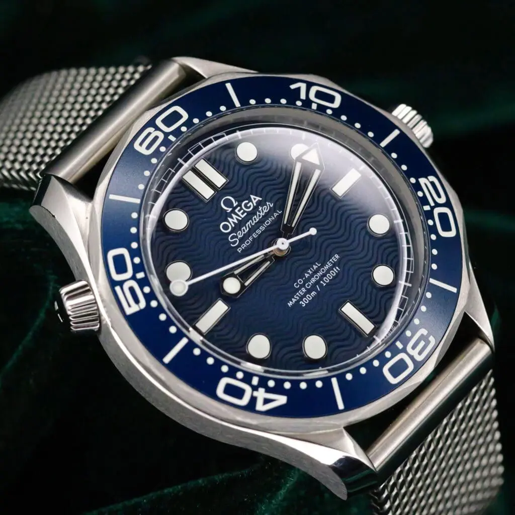 Omega Seamaster Diver 300M "James Bond" 007 60th Anniversary Edition Blue wave Dial Blue Ceramic Bezel Mesh Bracelet Stainless Steel 42mm MINT CONDITION COMPLETE SET 210.30.42.20.03.002