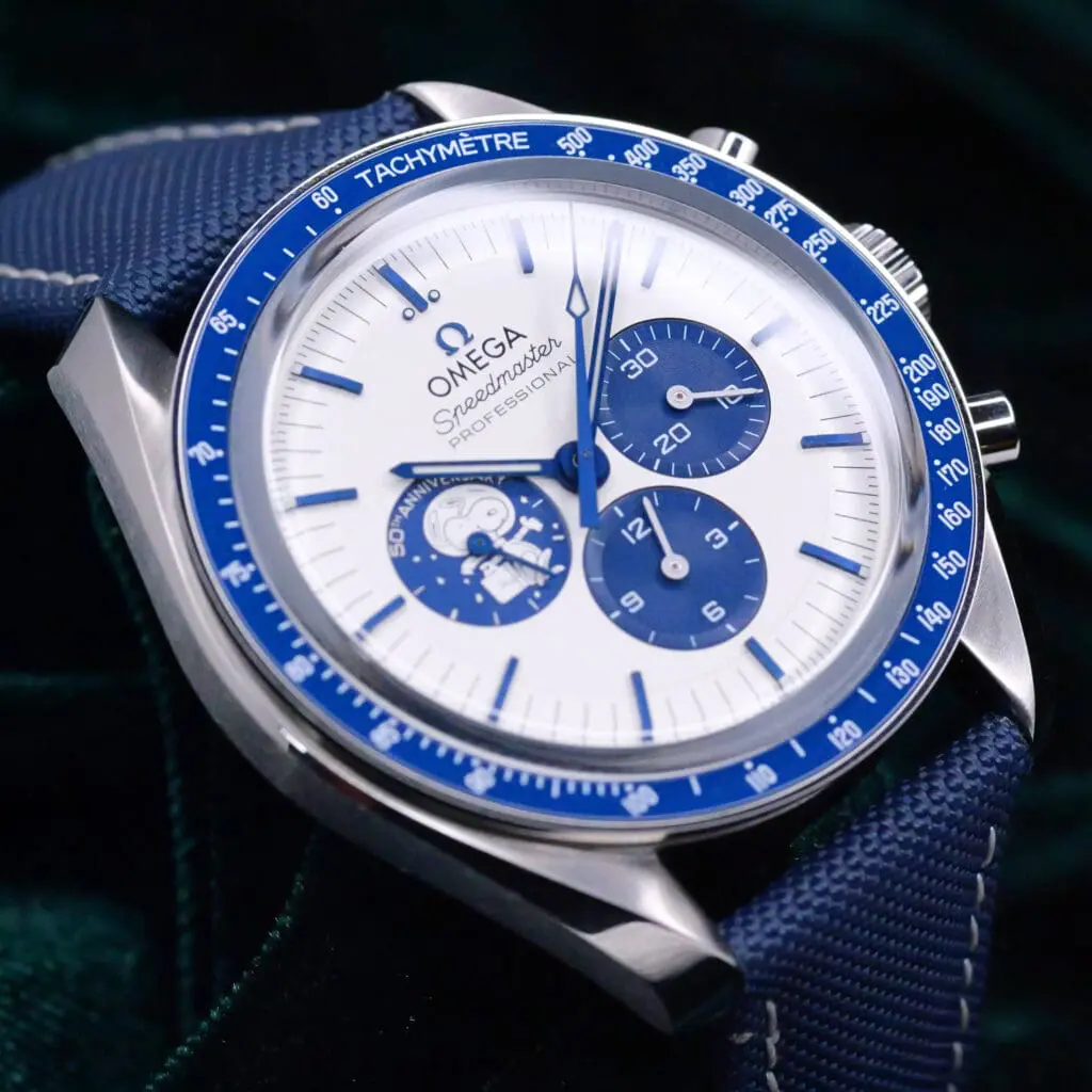 Omega Speedmaster Professional Moonwatch "Silver Snoopy Award" 50th Anniversary Silver Dial Blue Subdials Blue Ceramic Bezel Blue Fabric Strap Stainless Steel 42mm MINT CONDITION COMPLETE SET 310.32.42.50.02.001