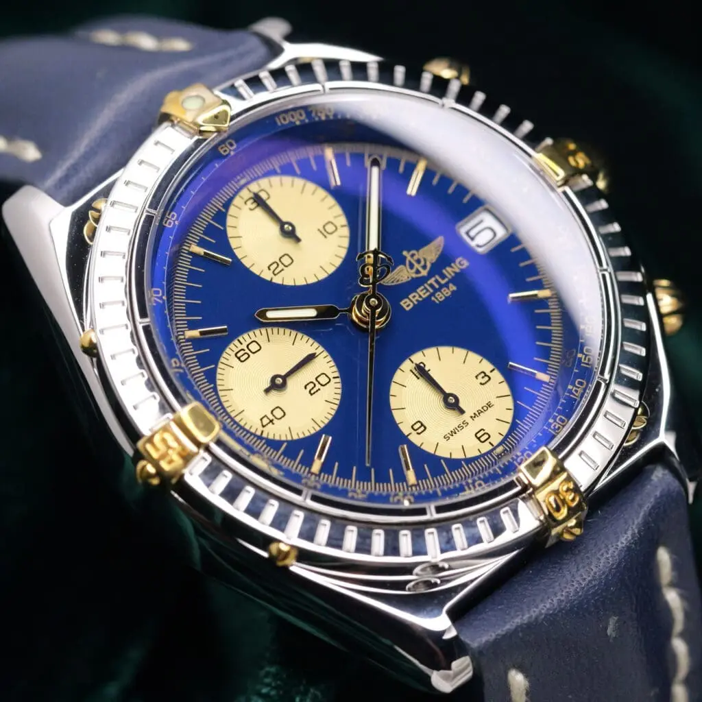 Breitling Chronomat Blue Dial Champagne Subdials Blue Leather Strap Two-Tone 18k Yellow Gold Stainless Steel 39mm MINT CONDITION B13050