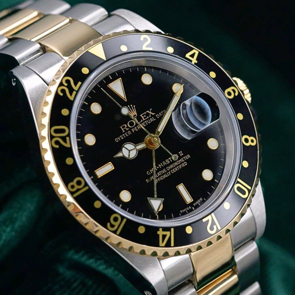Rolex GMT-Master II  Black Dial Black Aluminum Bezel Two Tone Yellow Gold Oyster Bracelet Stainless Steel 40mm MINT CONDITION COMPLETE SET 16713