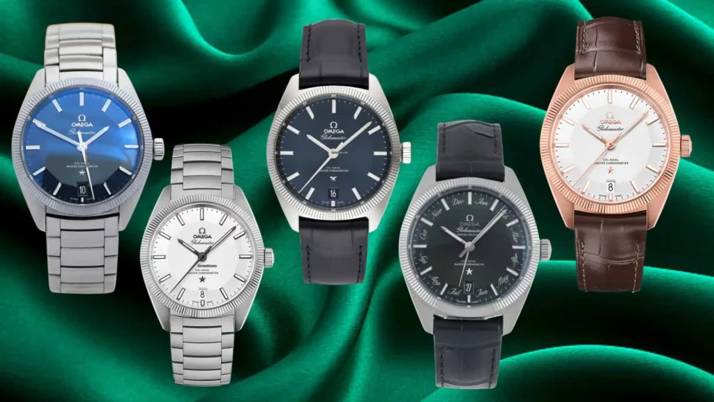 Five Omega Globemaster watches in various styles including blue, white, and black dials with leather and steel straps on a green silk background.