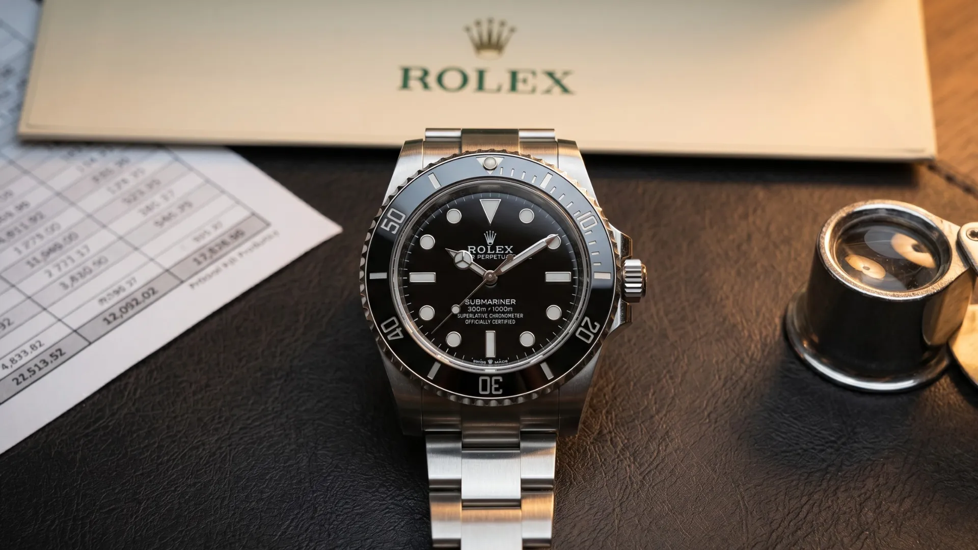 Rolex Submariner no-date black dial on steel bracelet beside Rolex papers, price sheet, and loupe on leather surface
