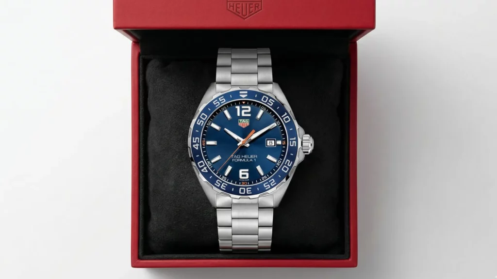 TAG Heuer Formula 1 blue dial with orange seconds hand on steel bracelet inside red TAG Heuer box