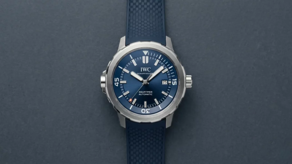 IWC Aquatimer Automatic with blue dial and matching blue rubber strap on grey background