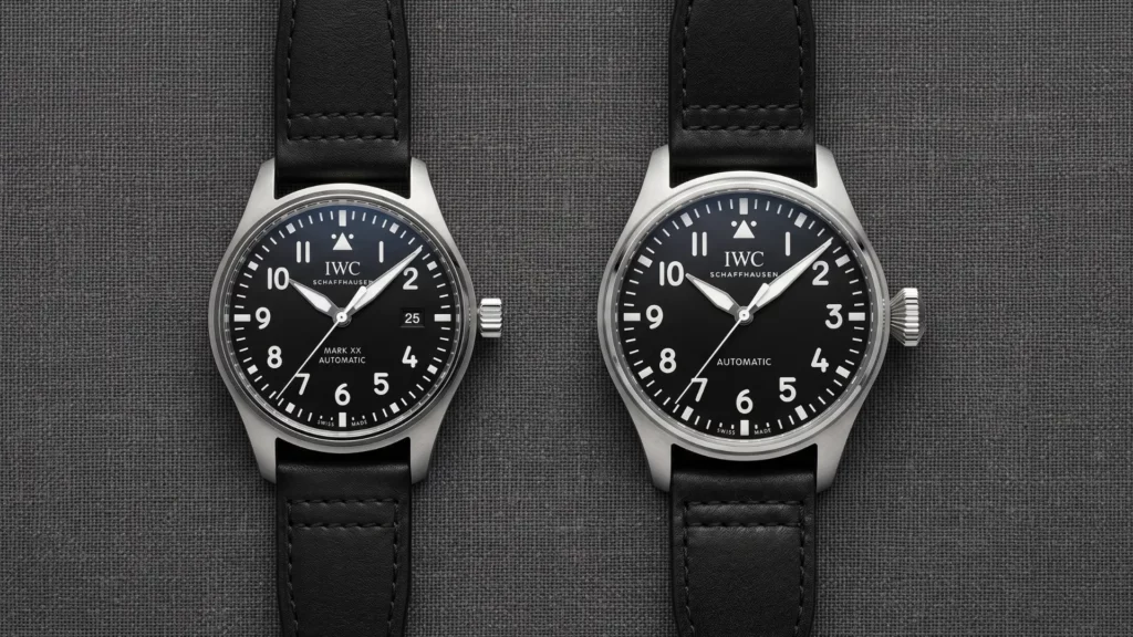IWC Pilot's Watch Mark XX and Big Pilot's Watch 43 with black dials side by side on black leather straps