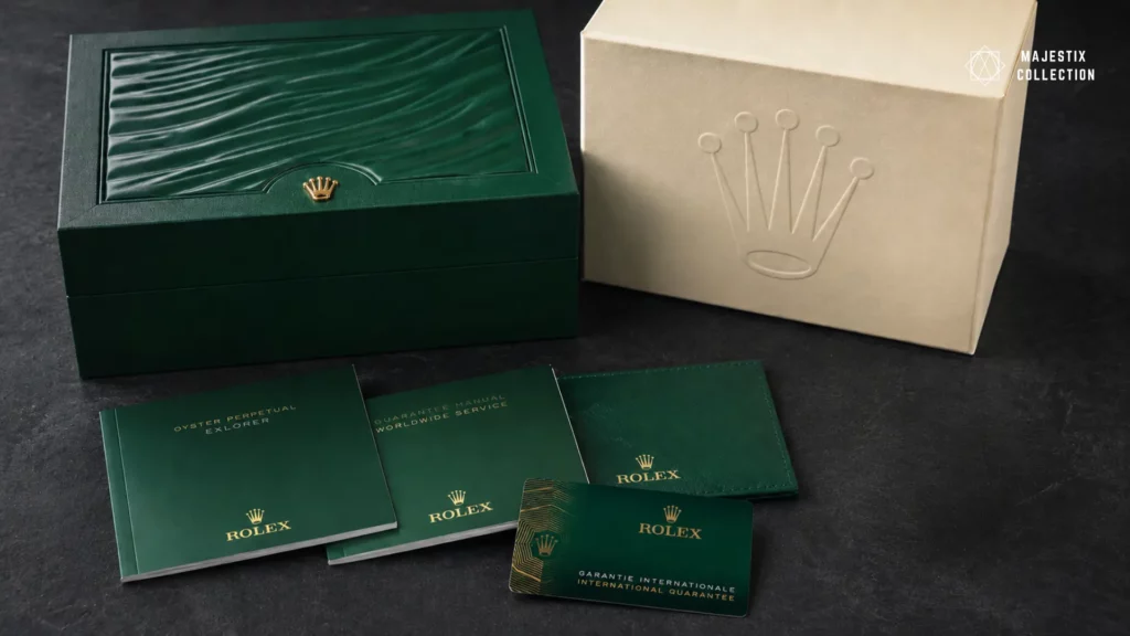 Rolex Explorer box and papers with warranty card and booklets on dark surface