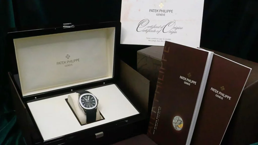 A complete Patek Philippe Aquanaut in its official box and certificate