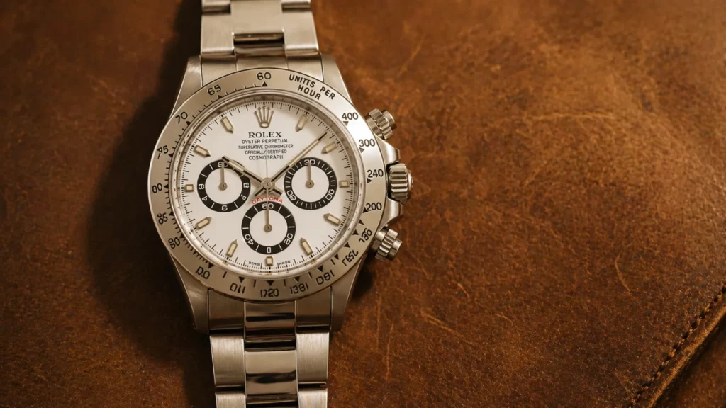 Rolex Daytona 16520 Zenith with white dial and black sub-dial rings on tan leather background
