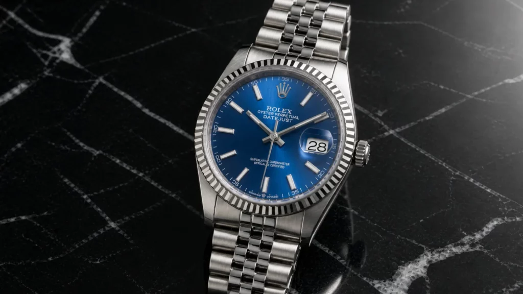 Rolex Datejust 126234 with blue dial and fluted bezel on Jubilee bracelet against black marble