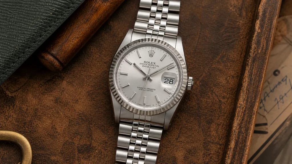 Rolex Datejust 16234 with silver dial and fluted bezel on Jubilee bracelet on aged leather
