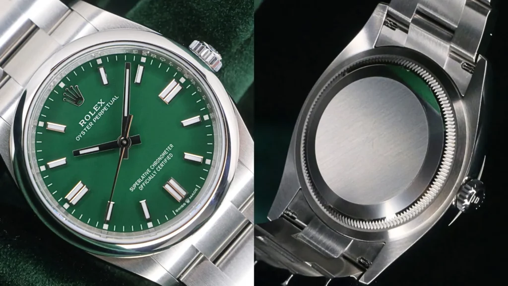 Rolex Oyster Perpetual green dial close-up next to brushed steel caseback on green velvet