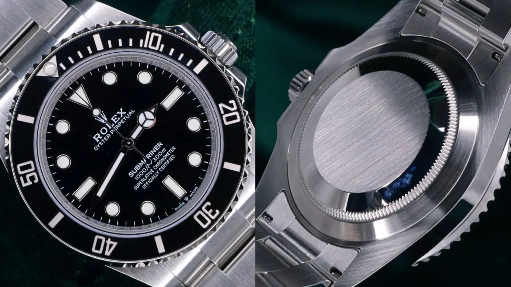 Rolex Submariner no-date black dial close-up next to brushed steel caseback on green velvet