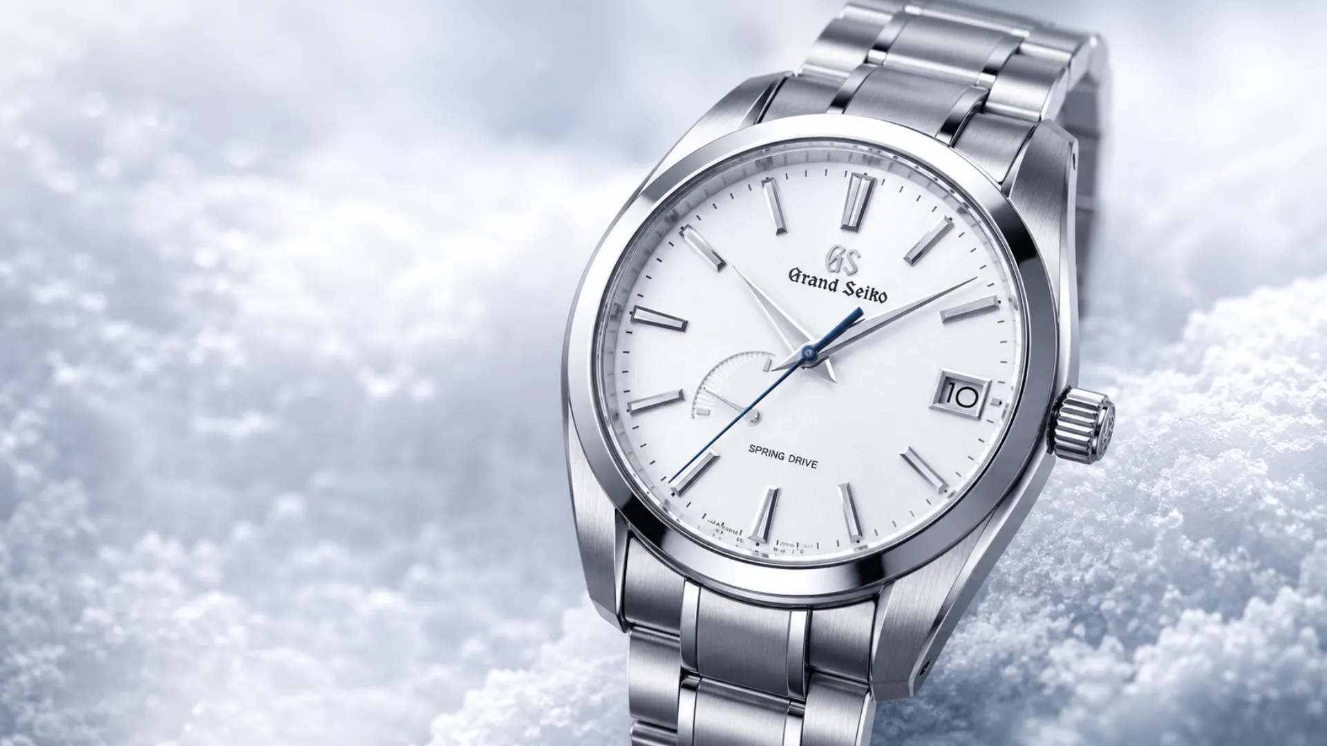 Grand Seiko Spring Drive watch with white dial on a snowy background