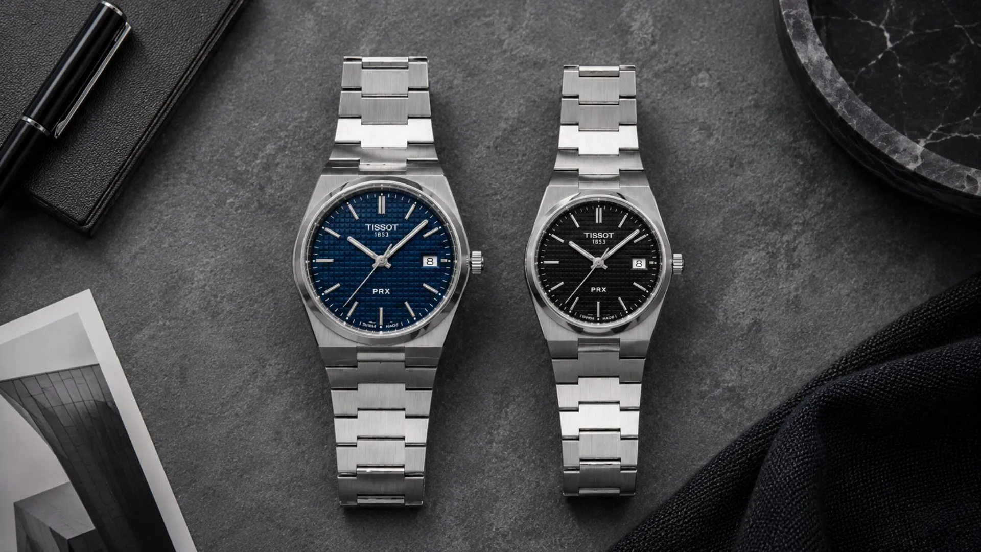 Tissot PRX 40mm Powermatic 80 buying guide — stainless steel bracelet watch on flat lay surface