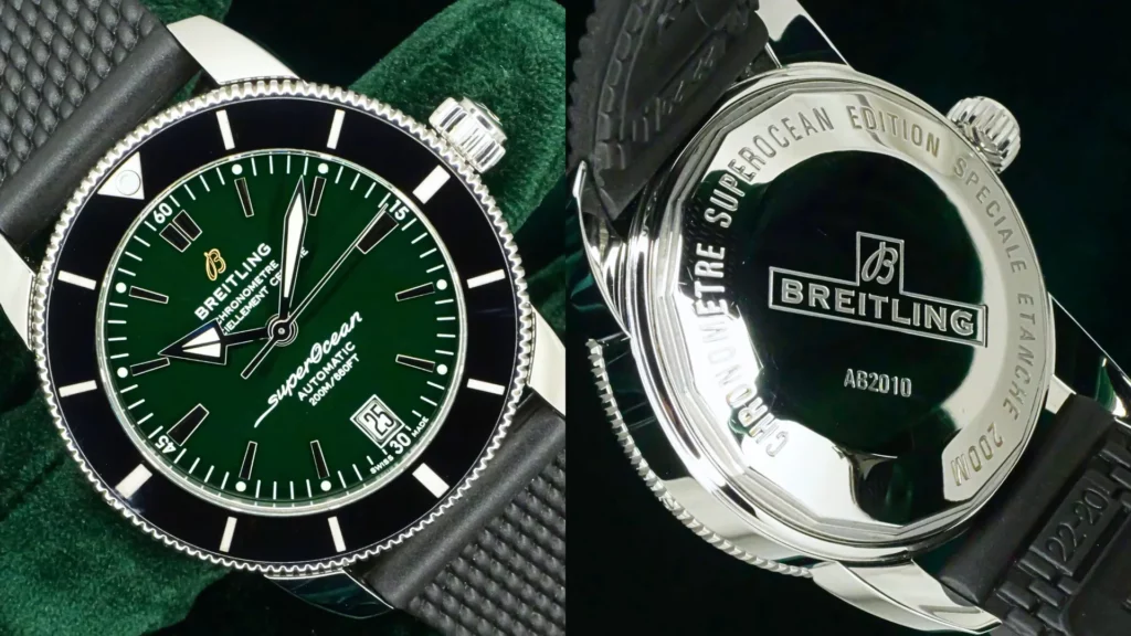 Close-up of Breitling Superocean Heritage with green dial and black bezel beside engraved caseback on green velvet