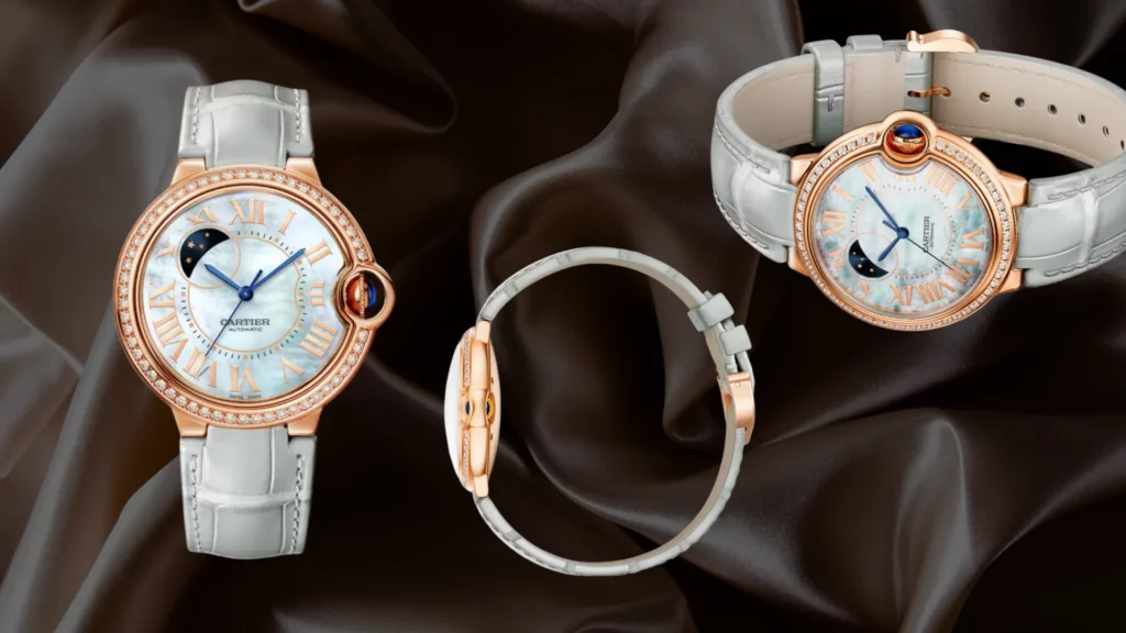 Three rose gold Cartier Ballon Bleu watches with white mother of pearl dials, diamond bezels, moon phase displays, and pale grey leather straps on dark satin fabric