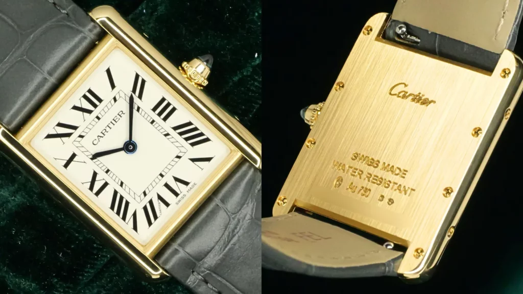 Close-up of Cartier Tank Louis yellow gold with white Roman numeral dial and blue sapphire crown beside engraved Au 750 gold caseback on green velvet