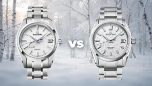 Grand Seiko Snowflake SBGA211 next to White Birch SLGH005 with snowy birch forest background