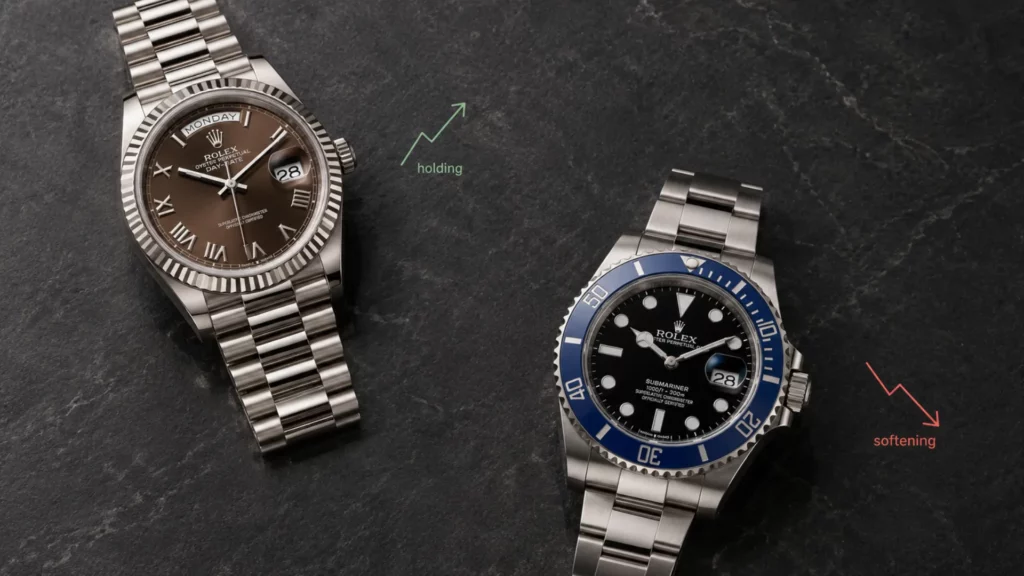 Rolex Day-Date with brown dial marked 'holding' and Rolex Submariner blue bezel marked 'softening' on dark slate