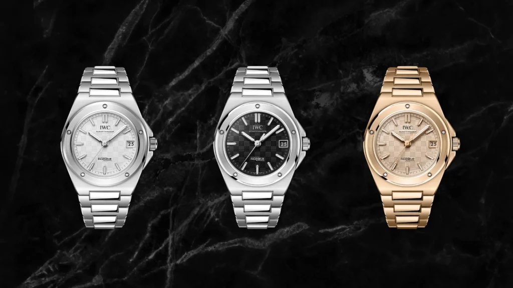 Three IWC Ingenieur Automatic 35 watches shown side by side in stainless steel and gold-tone finishes on a dark marble background.
