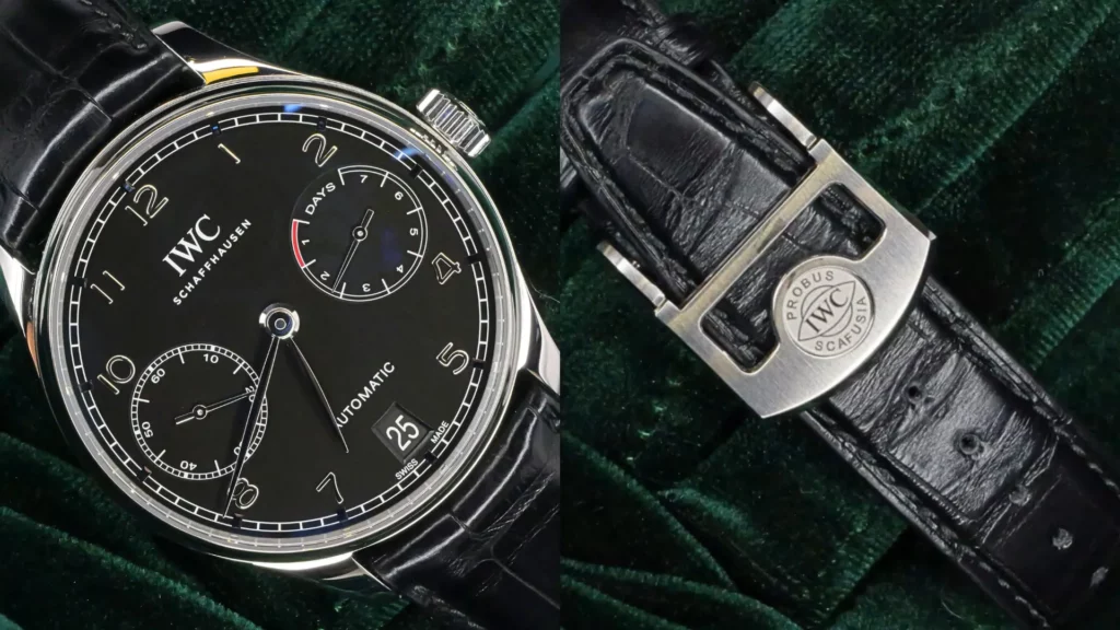 Close-up of IWC Portugieser Automatic with black dial, 7-day power reserve, and small seconds beside Probus Scafusia deployant clasp on green velvet