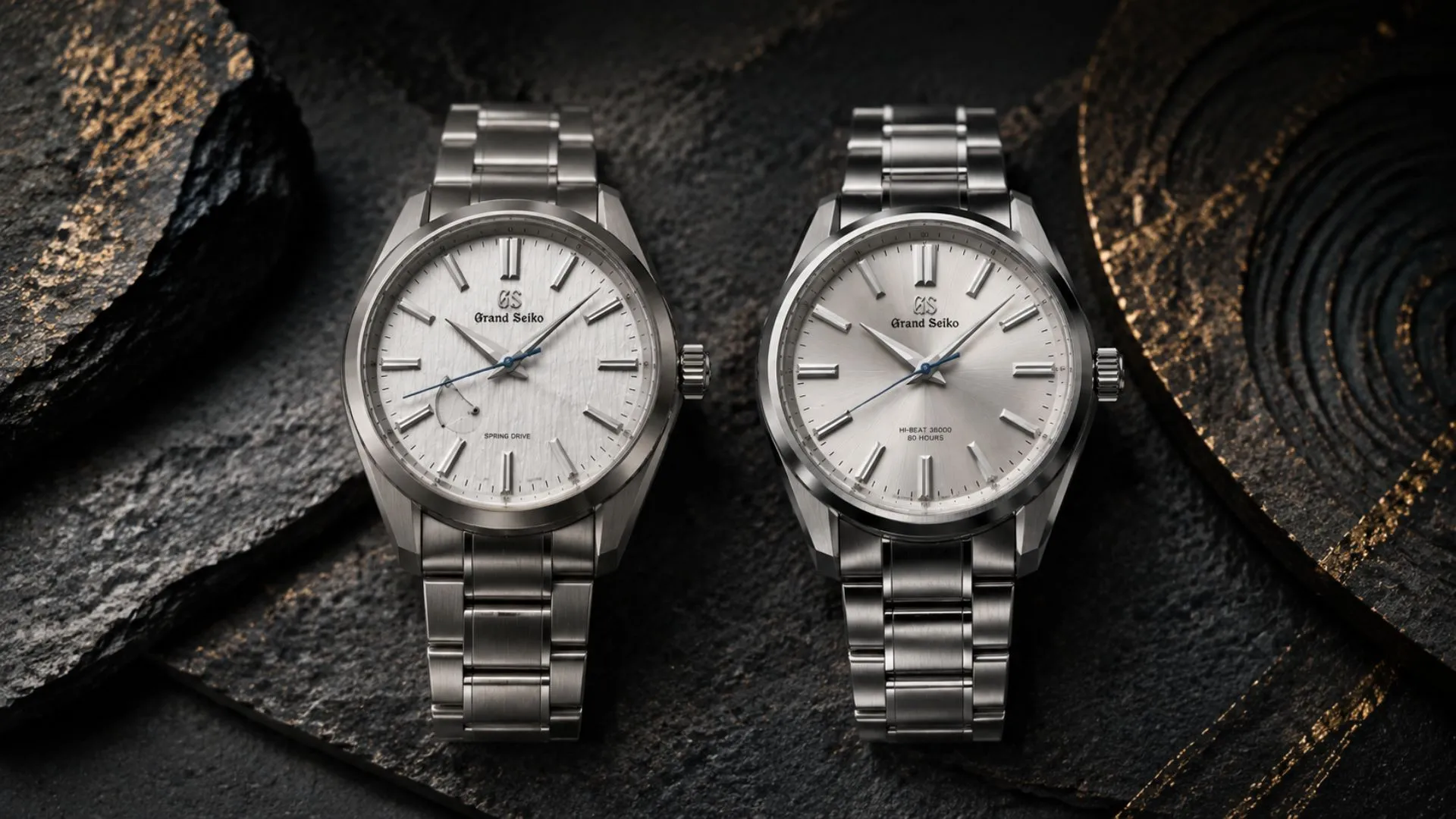 Grand Seiko Spring Drive vs Hi-Beat side-by-side watch comparison on a dark surface