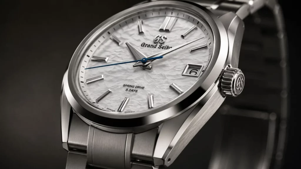 Macro of Grand Seiko Zaratsu polished case showing distortion-free mirror finish and sharp brushed edges
