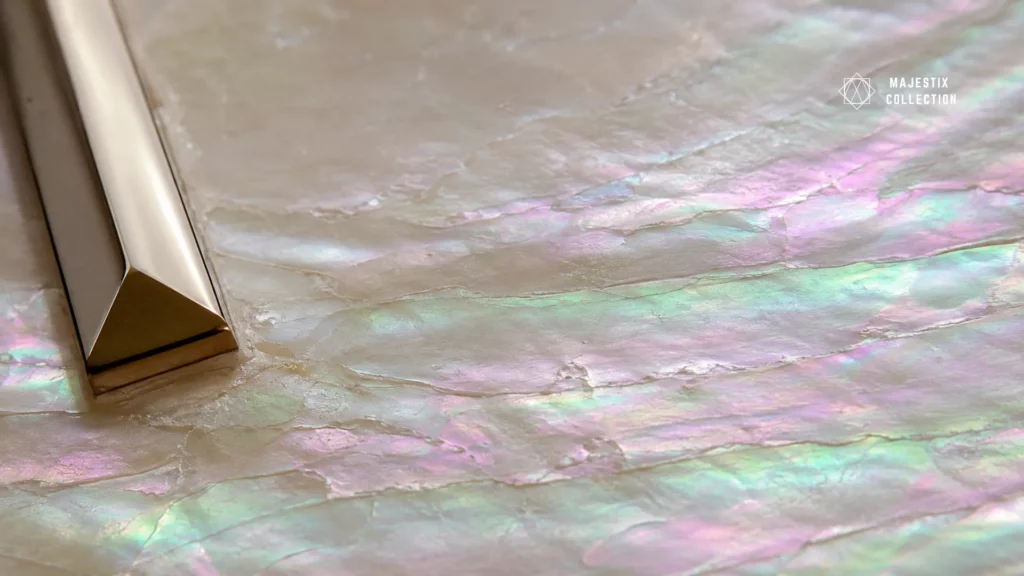 Macro close-up of a mother of pearl dial showing iridescent nacre layers shifting color in light