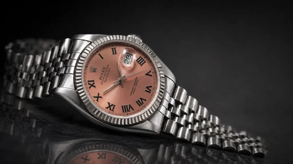 Neo-vintage Rolex Datejust 16220 in steel with salmon-pink sunburst dial on a Jubilee bracelet