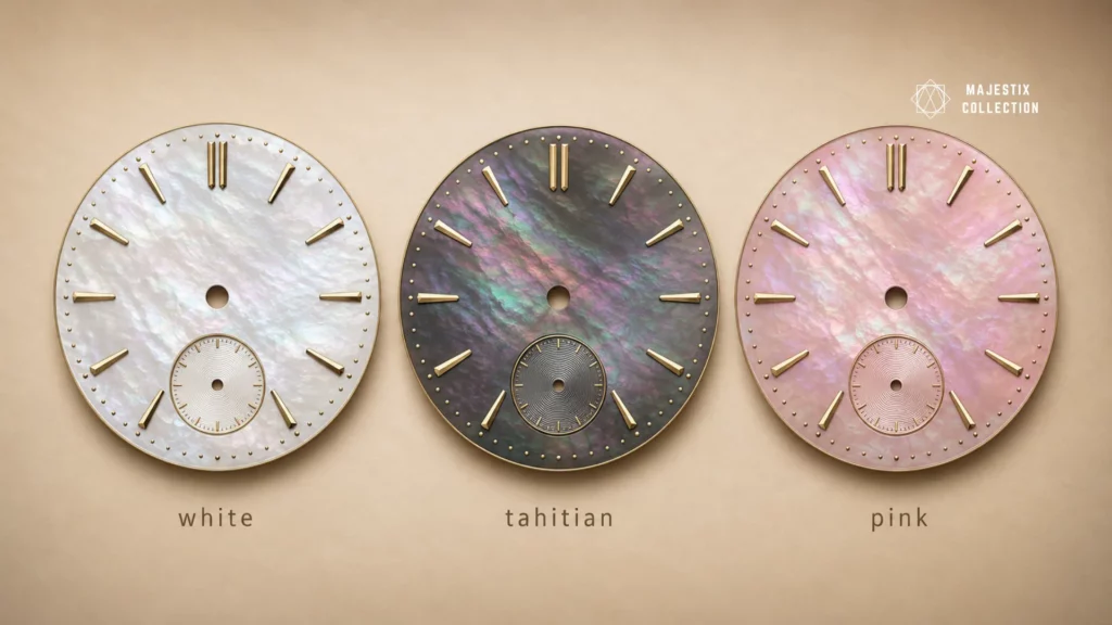 White, black Tahitian, and pink mother of pearl watch dials compared side by side