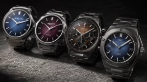Four fumé dial watches lined up: H. Moser blue, Agelocer burgundy, Zenith brown chronograph, and IWC blue