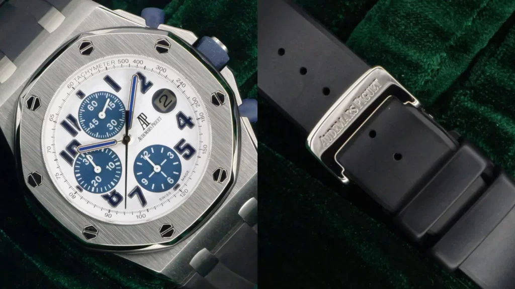 Audemars Piguet Royal Oak Offshore chronograph with white dial and blue subdials beside close-up of its black rubber strap with AP buckle on dark green velvet