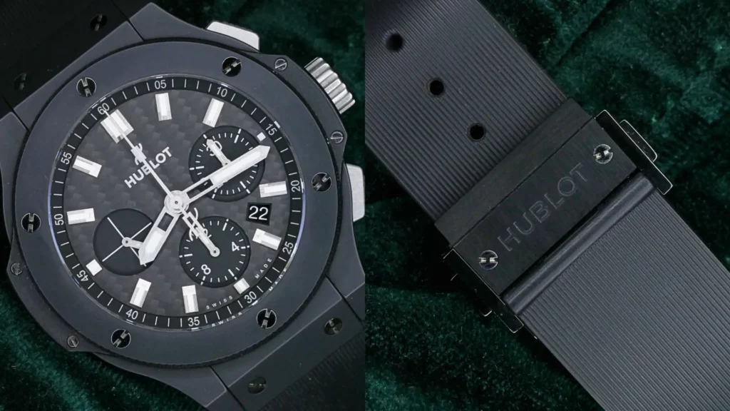 Hublot Big Bang Black Magic 44mm with black carbon dial and ceramic case on a black rubber strap, with strap detail
