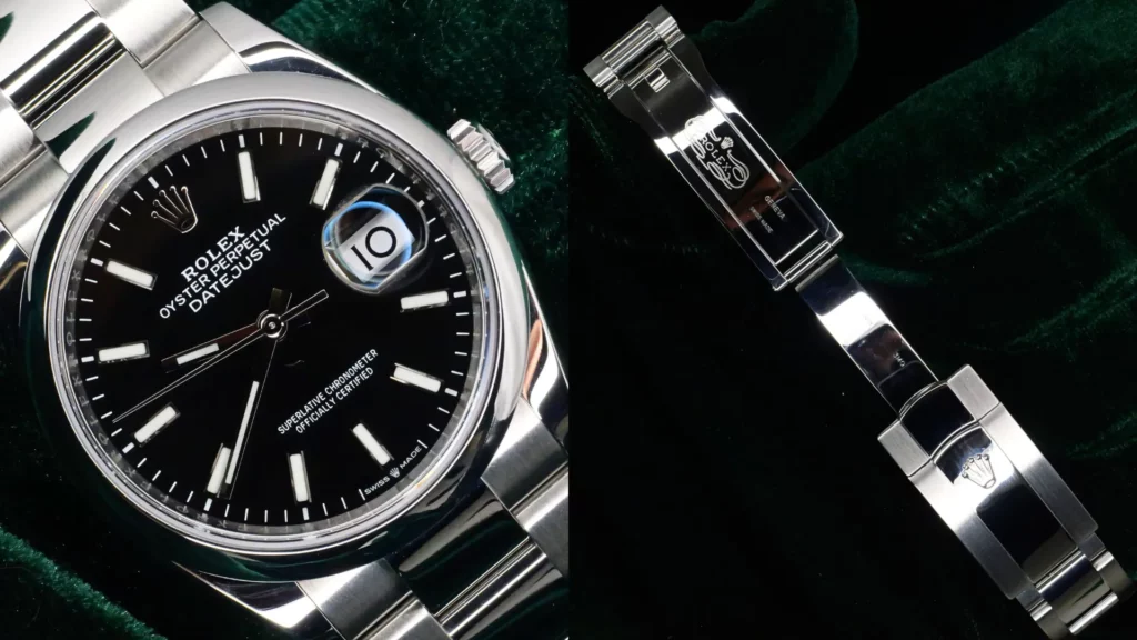 Steel Rolex Datejust with black dial close-up beside its Oyster bracelet clasp on green velvet