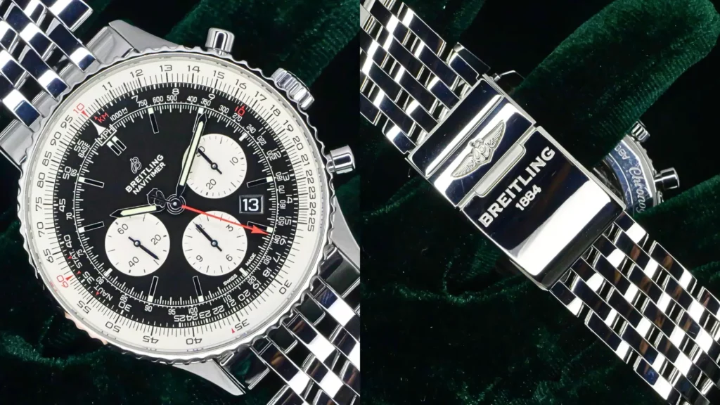 Breitling Navitimer chronograph with black dial and slide-rule bezel beside close-up of its steel bracelet clasp on dark green velvet