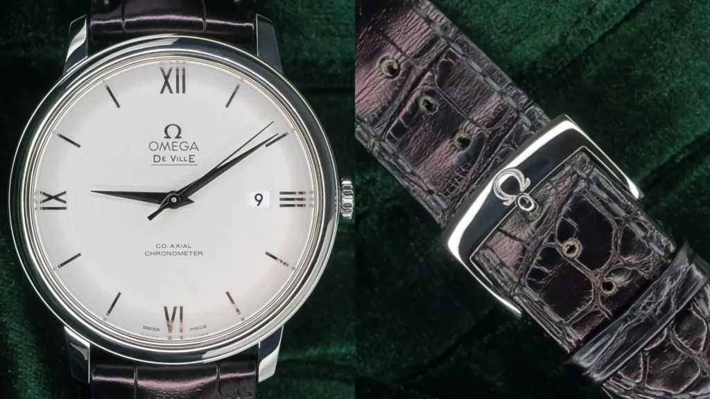 Steel Omega De Ville Prestige with silver dial and date on a brown alligator strap, alongside its Omega-signed buckle, on green velvet