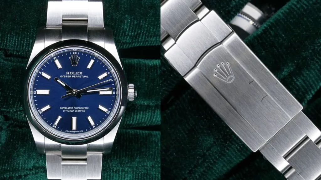 Steel Rolex Oyster Perpetual 34 with blue dial on an Oyster bracelet, alongside its crown-signed clasp, on green velvet