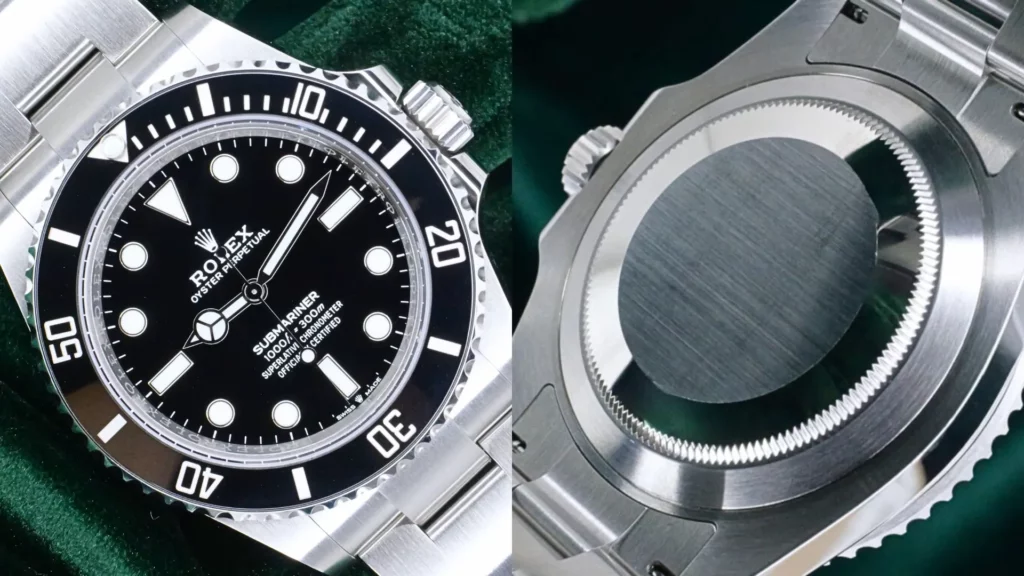Steel Rolex Submariner No Date with black dial and ceramic bezel beside its brushed caseback on green velvet