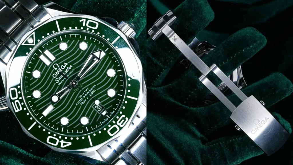 Omega Seamaster Diver 300M with green wave dial and bezel beside close-up of its steel bracelet clasp on dark green velvet