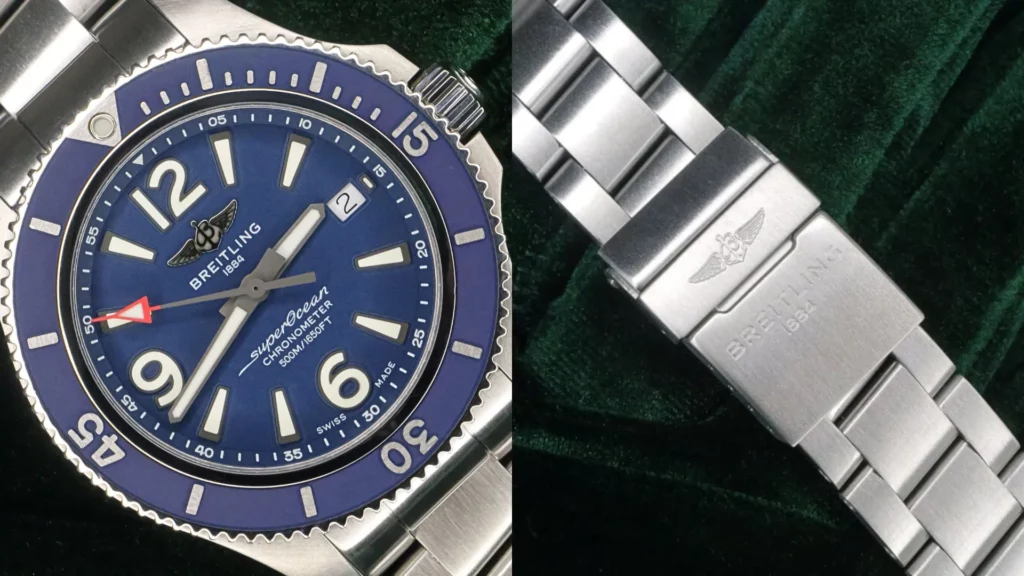 Breitling Superocean diver with blue dial and bezel beside close-up of its steel bracelet clasp on dark green velvet