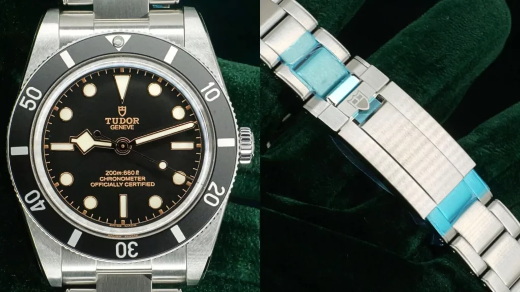 Steel Tudor Black Bay 54 with black dial and bezel on a steel bracelet, alongside its shield-signed clasp with protective film, on green velvet