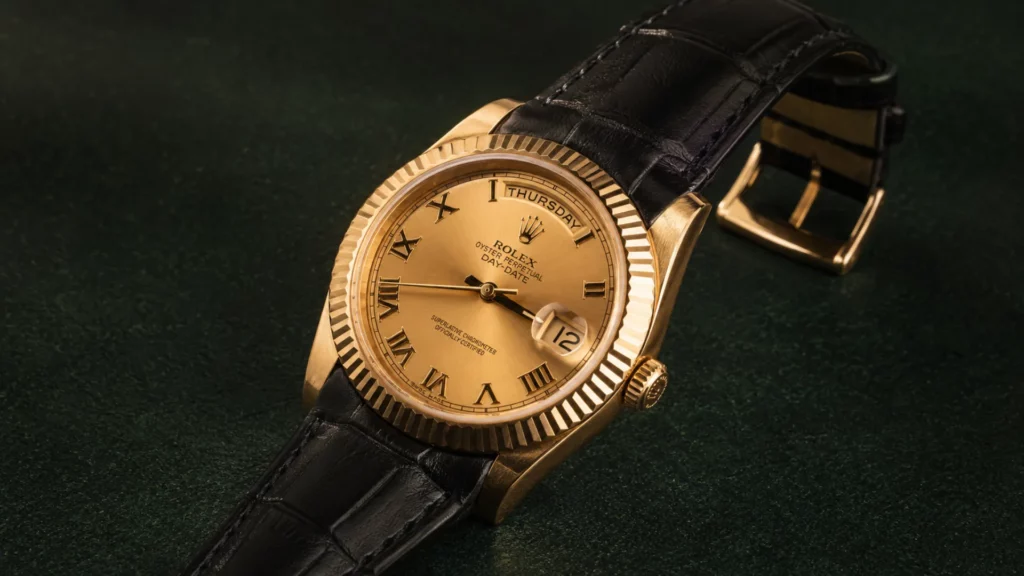 Rolex Day-Date 218238 champagne Roman dial yellow gold on black leather strap with gold buckle