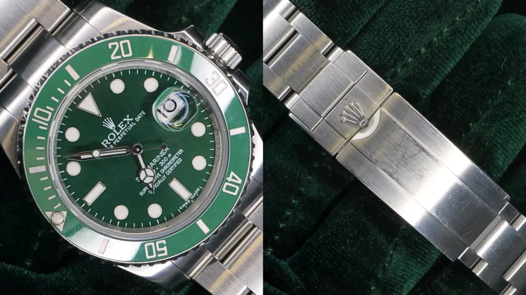 Rolex Hulk Submariner with green dial and green bezel close-up beside brushed steel Oyster clasp
