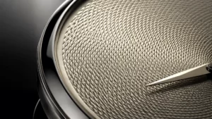 Macro of a hand-cut guilloché dial catching raking light, one of the best guilloché dial watches