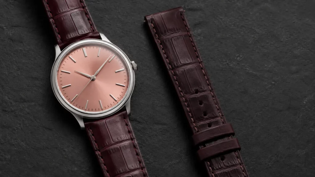 Deep burgundy alligator strap paired with a salmon dial white gold watch case