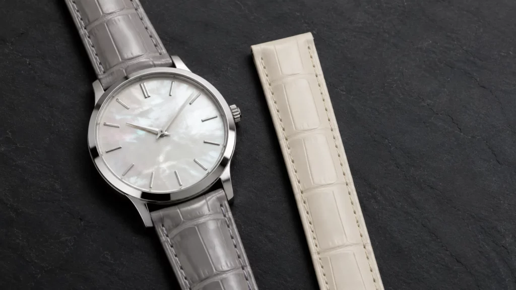 Pearl gray and cream alligator straps with a mother-of-pearl dial white gold watch case