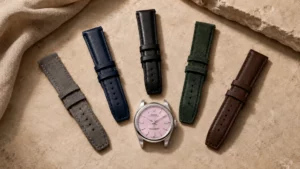 Pink dial luxury watch shown with five strap color options in a flat lay guide