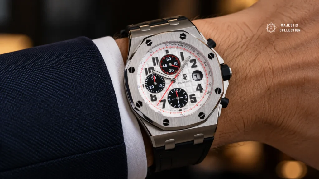 White dial watch on a black leather strap worn with a navy suit for business formal