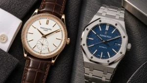 Rose gold Patek Philippe Calatrava on brown leather beside a steel Audemars Piguet Royal Oak with blue dial