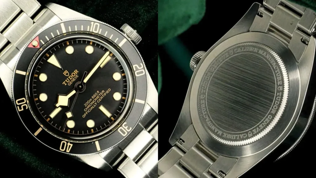 Tudor Black Bay black dial with gilt accents and solid engraved caseback on dark green background